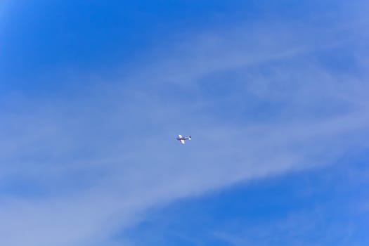 Photo of flying military airplane in blue sky