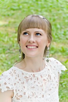 Portrait of beautiful girl with blue eyes looking upwards