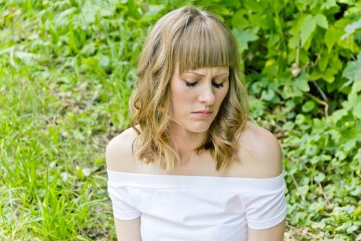 Portrait of beautiful girl with close eyes on green background