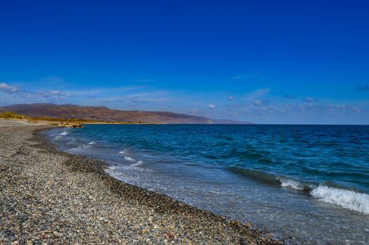 View of the pebble beach of Maleme in the north west of the island of Crete in Greece