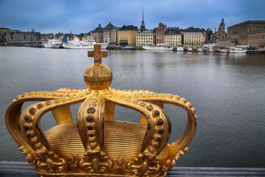 Skeppsholmsbron (Skeppsholm Bridge) with Golden Crown on a bridge in Stockholm, Sweden