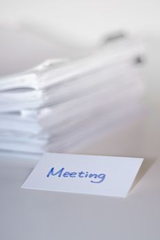 Meeting; Stack of Documents on white desk and Background.