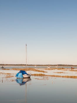beautiful peaceful harbour scene estuary maldon boat mast reflections; essex; england; UK
