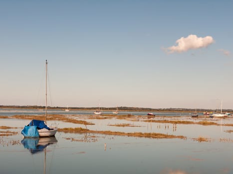 beautiful peaceful harbour scene estuary maldon boat mast reflections; essex; england; UK