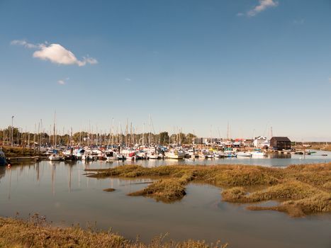 landscape view scene of boats moored in dock marina harbour; essex; england; UK