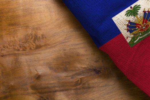 National flag of Haiti on a wooden background