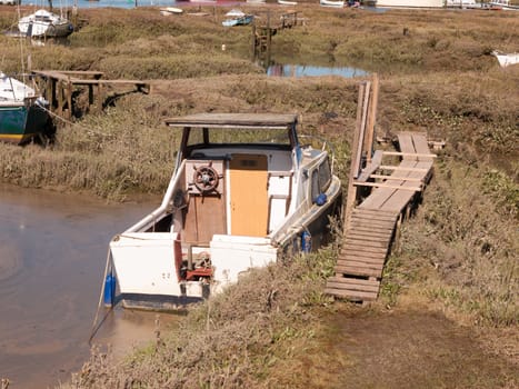 boat close up parked in estuary marshland tollesbury maldon; essex; england; UK