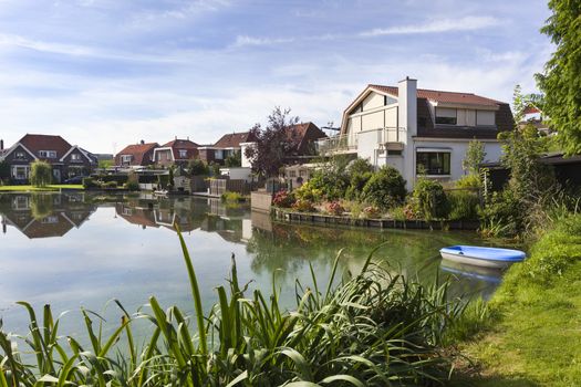 Traditional houses around a pond in Krimpen aan den IJssel in the Netherlands