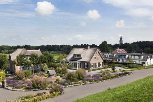Dike and houses in Schoonhoven along the river Lek in the Netherlands