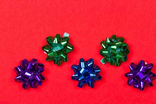 Bows for anniversary decoration on red background