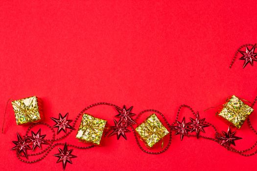 Christmas red background with gift and decoration on the red background