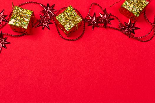 Christmas red background with gift and decoration on the red background
