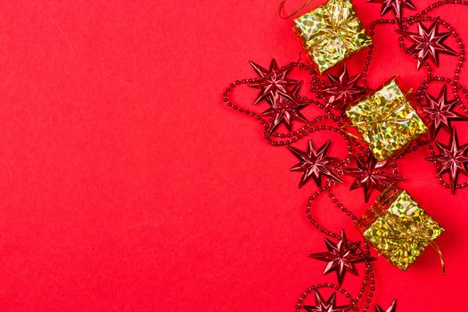 Christmas red background with gift and decoration on the red background