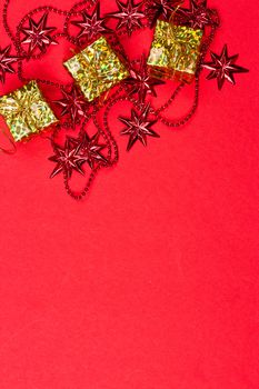 Christmas red background with gift and decoration on the red background