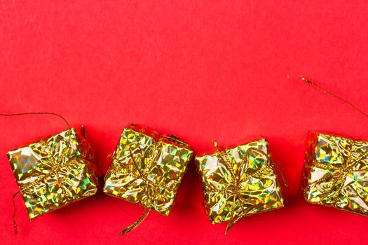 Christmas red background with gift and decoration on the red background