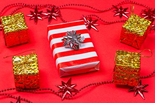 Christmas red background with gift and decoration on the red background