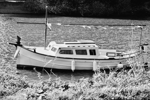 Small yacht on the river in Richmond, London. Water concept.