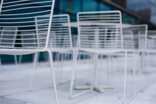 White empty chairs outdoors in Oslo, Norway