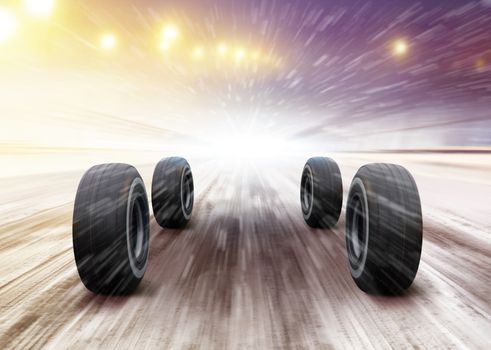 four automobile wheels rush on winter road in snowstorm