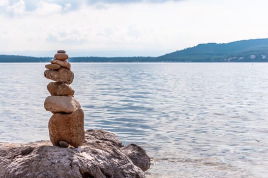 Pile of stones on the sea in a sunny day of autumn