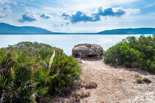 World war two bunker on Sardinia's coast in a cloudy day