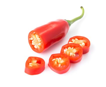 Closeup top view red chili pepper with sliced on white background, raw food ingredient concept