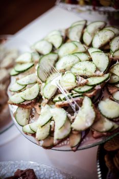 Beautiful cucumber salad laid out a reception hall for all to enjoy.