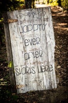 Rustic, rusted door used in a wedding to let people know where the wedding is located.