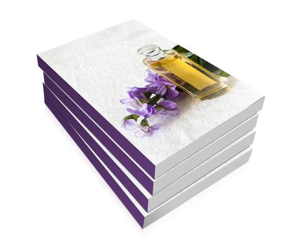 book of a perfume flask over a white towel