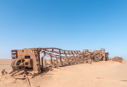 The rusted remains of an abandoned oil drilling rig between Henties Bay and Torra Bay in the Skeleton Coast area of Namibia
