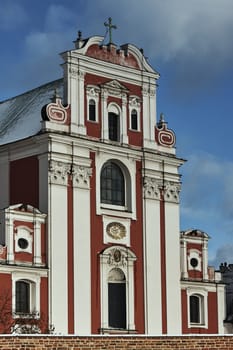 Baroque Catholic Church behind medieval defensive wall in Poznan