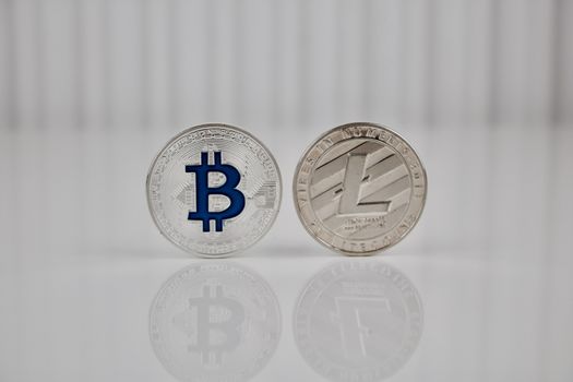 Cryptocurrency physical silver bitcoin and silver litecoin coin.