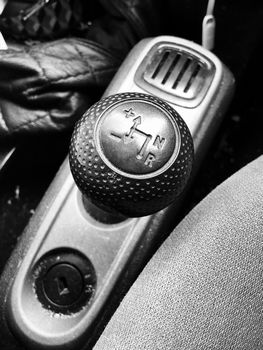 Black gearbox in semi auto car. Automotive black and white concept.