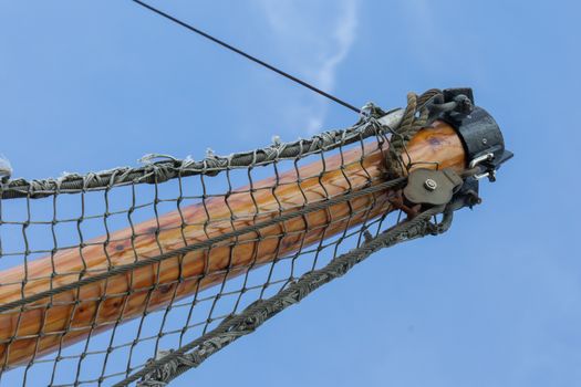 Bowsprit tree in front of a fishing boat with a hanging net - The Netherlands