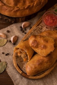 Different pies from meat and vegetables. Freshly baked cakes on a table