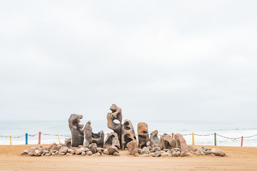 A display of weathered rocks on a dune in Henties Bay, a holiday town on the Skeleton Coast of Namibia
