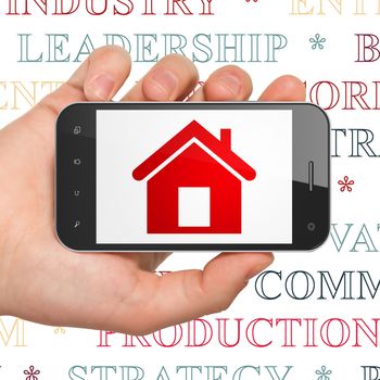 Business concept: Hand Holding Smartphone with  red Home icon on display,  Tag Cloud background, 3D rendering