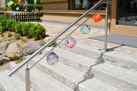 Stainless steel staircase with four handmade glass balls