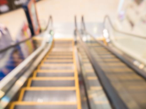 Defocus of escalater,view from top to ground,in department store,Thailand