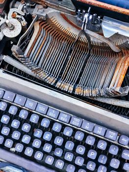 Old retro unnecessary faulty typewriter, professional writer equipment. Installation Krakow, Poland