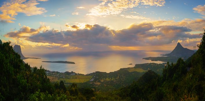 View from Piton de la Petite Riviere Noire, highest peak of Mauritius. Panorama at sunset.Le Morn Brabant on background.