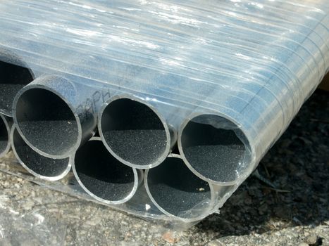 Stack of Many Pipes at the Construction Site