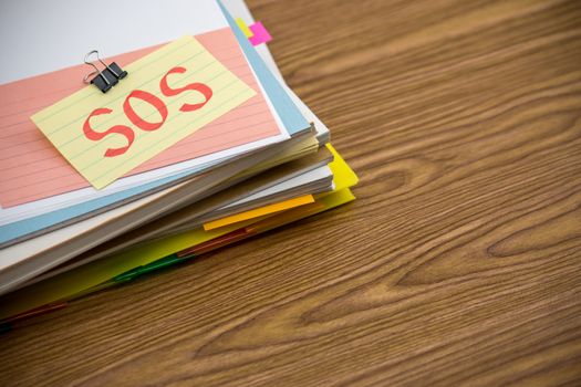 SOS; The Pile of Business Documents on the Desk