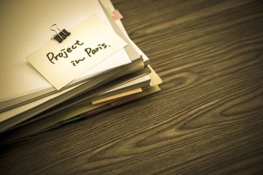 Project in Paris; The Pile of Business Documents on the Desk