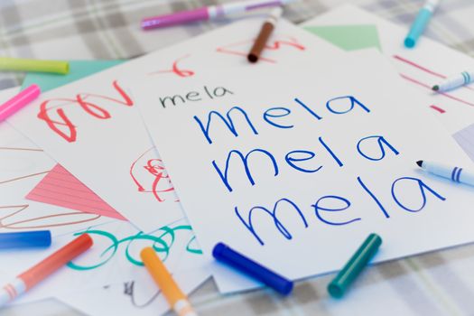 Italian; Kids Writing Name of the Fruits for Practice (Translation; Apple)