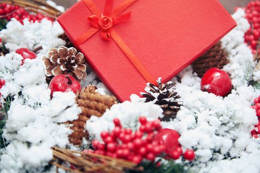 Christmas gift in a red box. Close-up horizontal photo