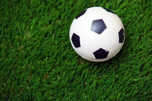 Soccer ball on a grass. Horizontal photo