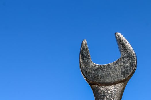 The Isolated Wrench with the Blue Sky Background