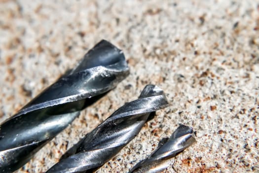 The Isolated Drill Bits with the Gray Ground Background