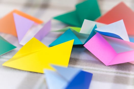 Randomly Scattered Small Origami Paper on the Table